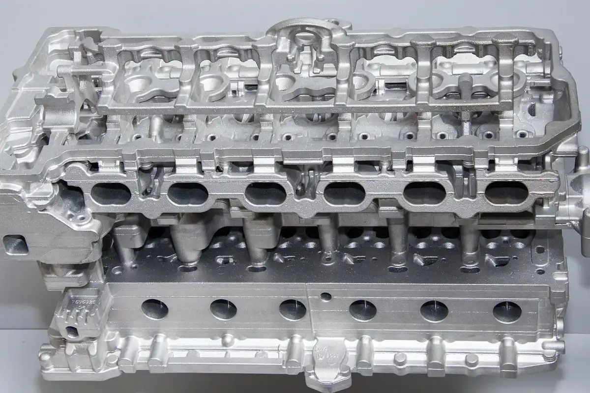 Aluminum cylinder head casting for a six-cylinder engine
