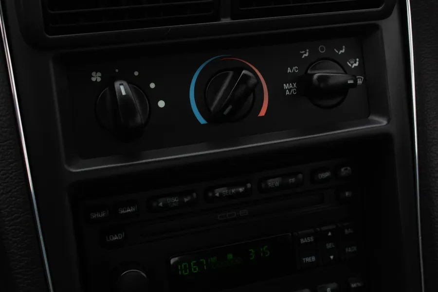 Climate control panel with A/C and Max A/C buttons in a car