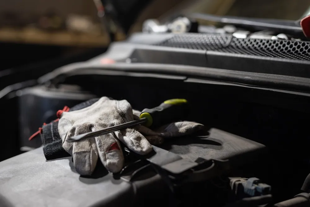 Emptying a car glove compartment to search for lost keys