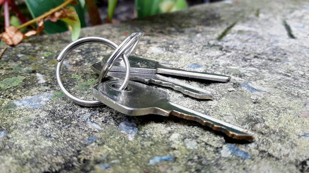 Locksmith working on a car door lock