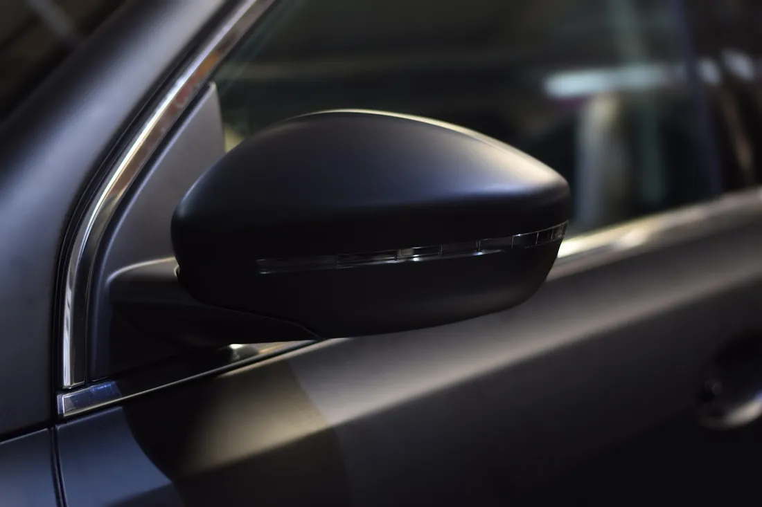 Dark matte-finish paint on a car mirror housing