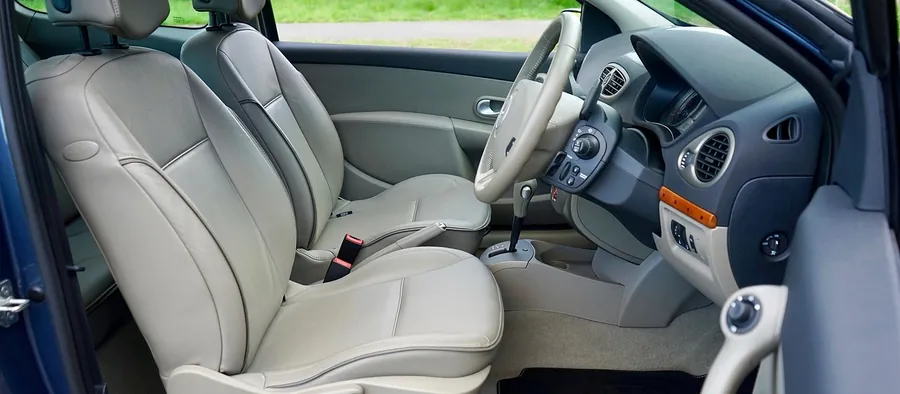 Light grey leather front seats inside a car