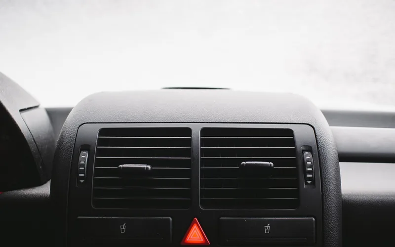 Traction control TC warning light illuminated on a car dashboard cluster