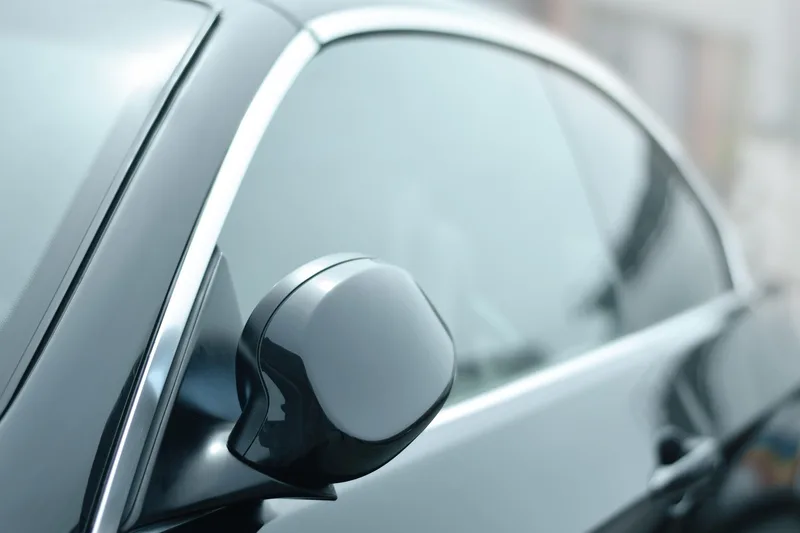 tinted car side window and mirror