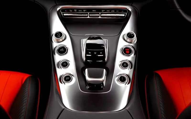 Traction control button on a car center console used to manually disable TC