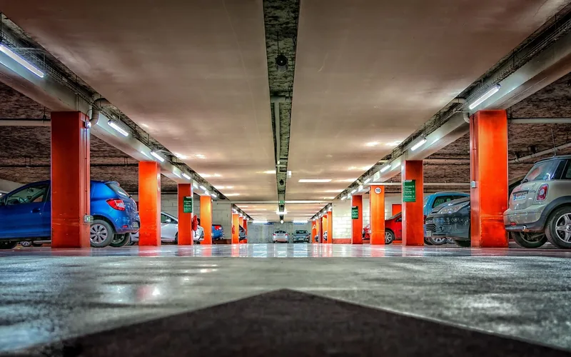Underground parking garage with an empty numbered space where a rental car was parked