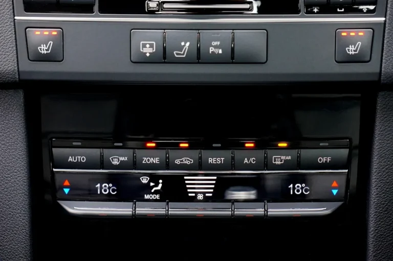 Automatic climate control panel with AUTO, A/C and air-source buttons