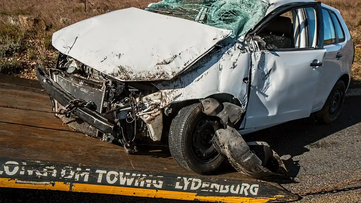Car with front-end damage after a collision, the kind of impact that can jolt the body even in a low-speed crash