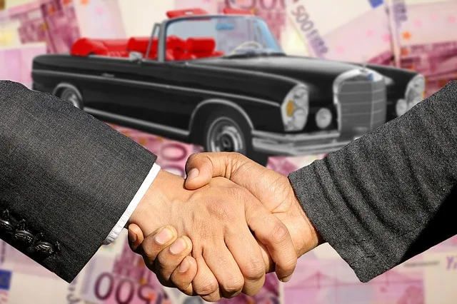 Handshake after a car sale agreement