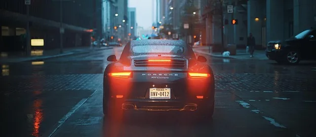 Car stopped in traffic with engine running