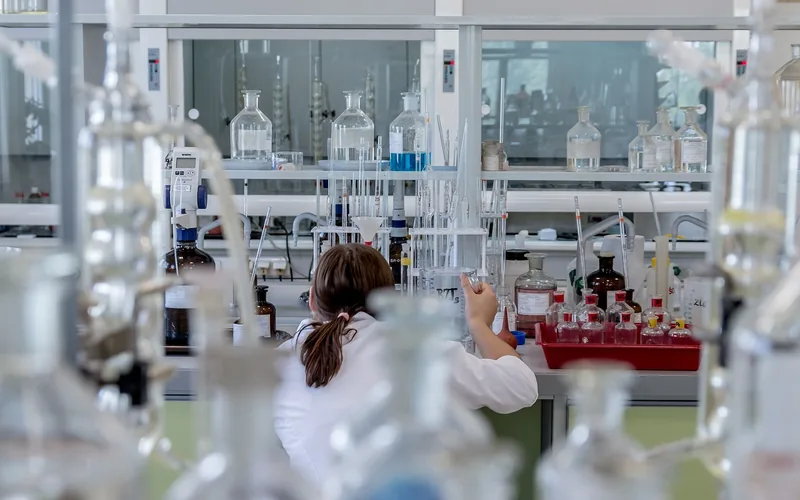 chemist analyzing a liquid sample in a research laboratory