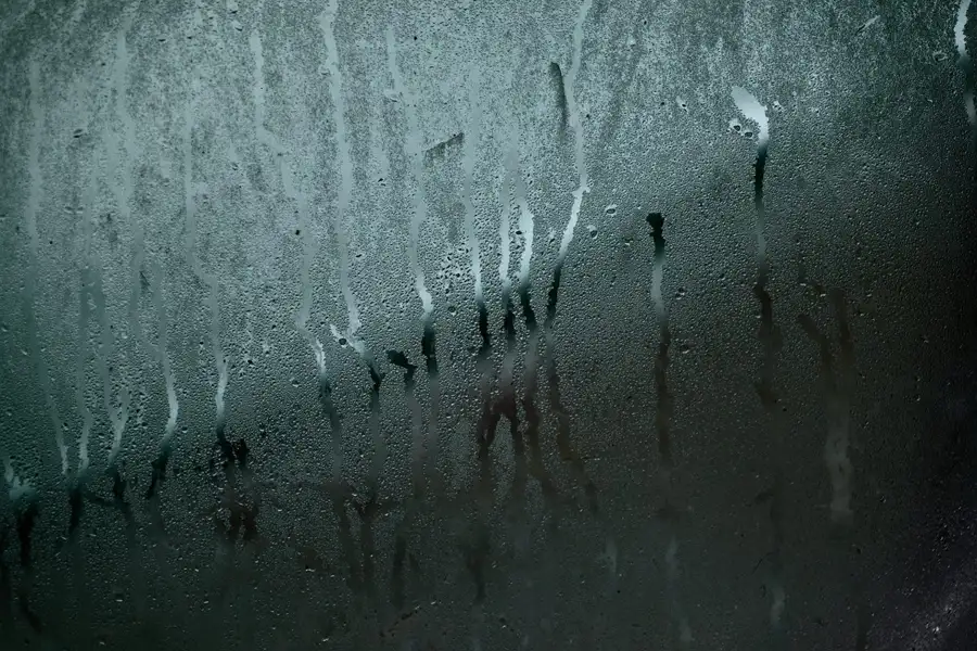 Condensation droplets and streaks on a window glass