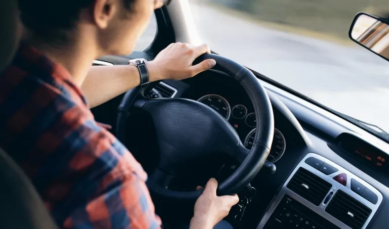 Driver with hands on the steering wheel during a road test