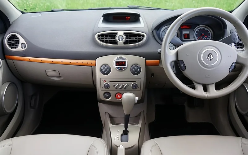 Automatic transmission gear lever inside a car next to the center console