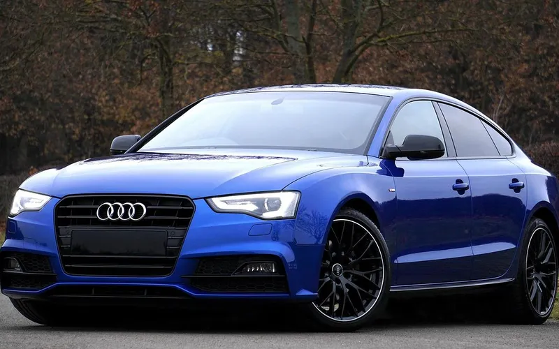 Blue hatchback shown from the front with no front license plate fitted on the bumper