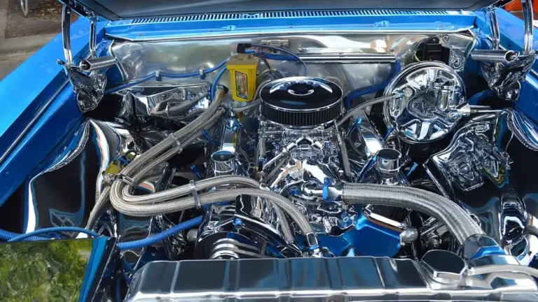 Chrome-detailed car engine seen under an open hood