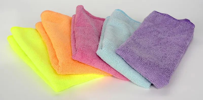 Stack of folded colored microfiber cleaning cloths