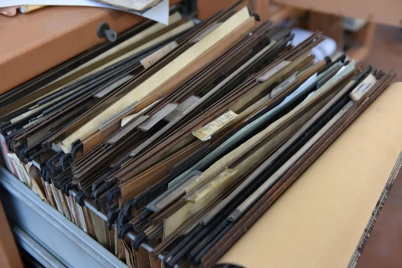 Drawer packed with hanging file folders used for keeping records
