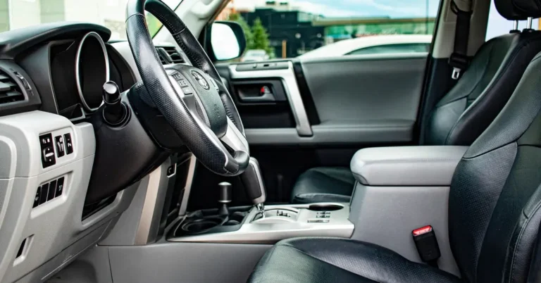 Clean SUV interior showing dashboard, door panel, and leather seats free of scuff marks