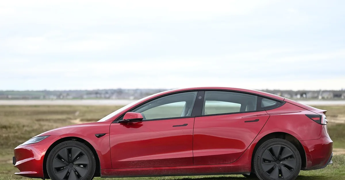 A modern four-door sedan viewed from the side, the vehicle type Uber requires for passenger rides