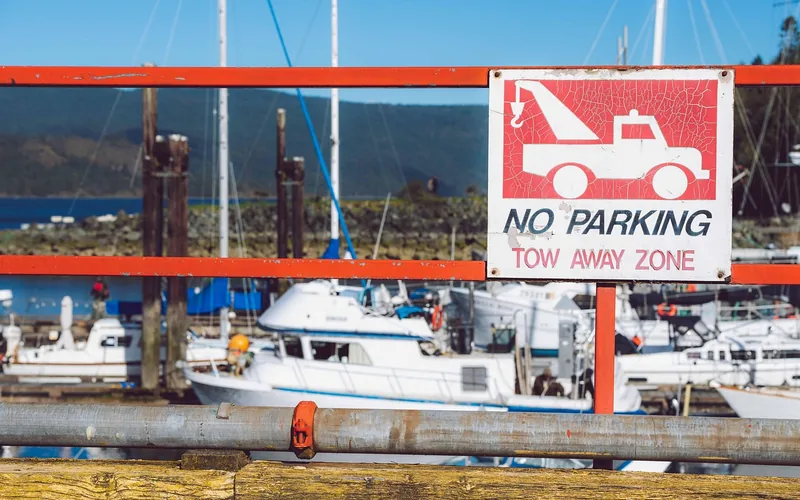 No parking tow-away zone warning sign posted on private property No parking tow-away zone warning sign posted on private property