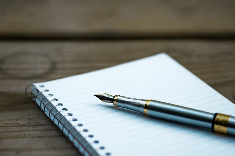 Notebook with a fountain pen for writing down dealer quotes