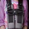 Padded chest clip guard for a Graco car seat harness