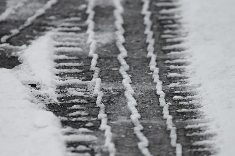 Tire tracks in snow on a road