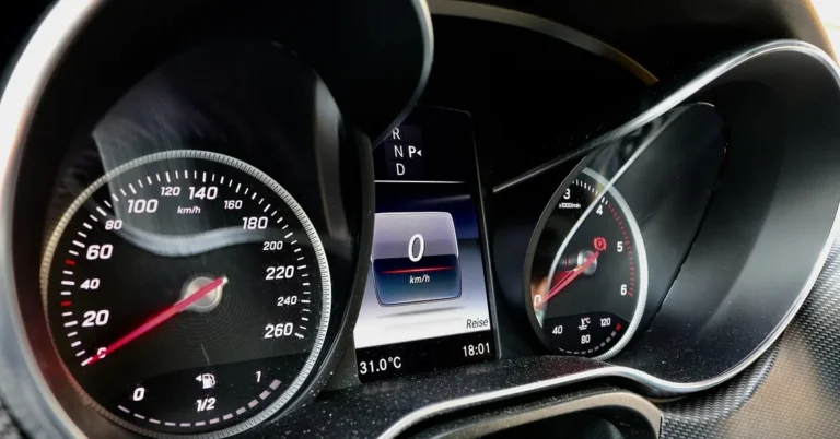 Car dashboard instrument cluster with the speedometer at zero