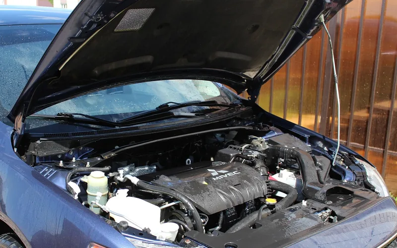 Clean engine bay with visible fuse box, hoses and wiring after a careful wash Clean engine bay with visible fuse box, hoses and wiring after a careful wash