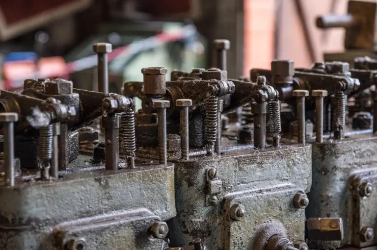 Rocker arms, valve springs and pushrods on an old engine cylinder head