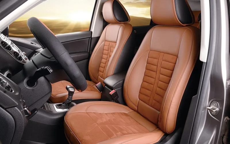 Front leather seat with stitched bolsters and suede-look center panel