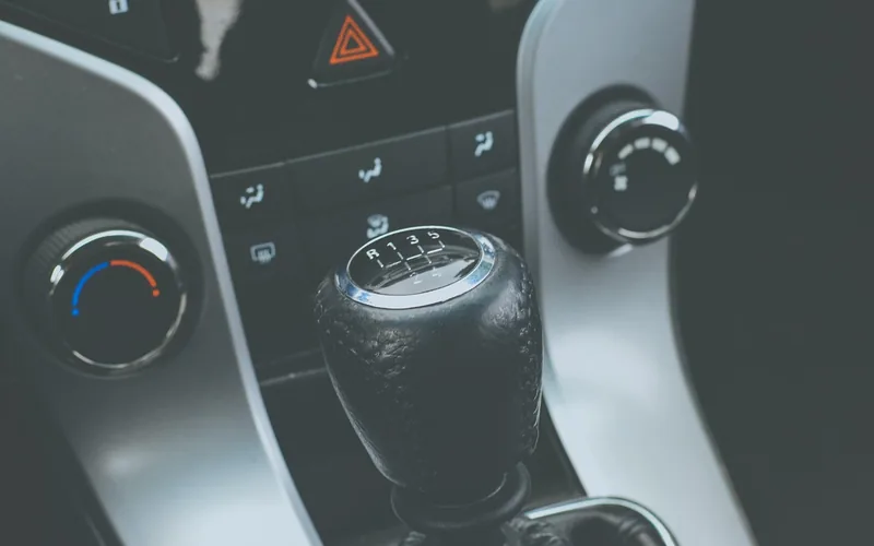 Leather manual gear shift knob with a five-speed shift pattern on top