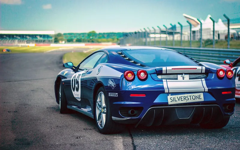 Blue hypercar-style sports car on a race track, representing the real-world hypercar class the Regera belongs to Blue hypercar-style sports car on a race track, representing the real-world hypercar class the Regera belongs to