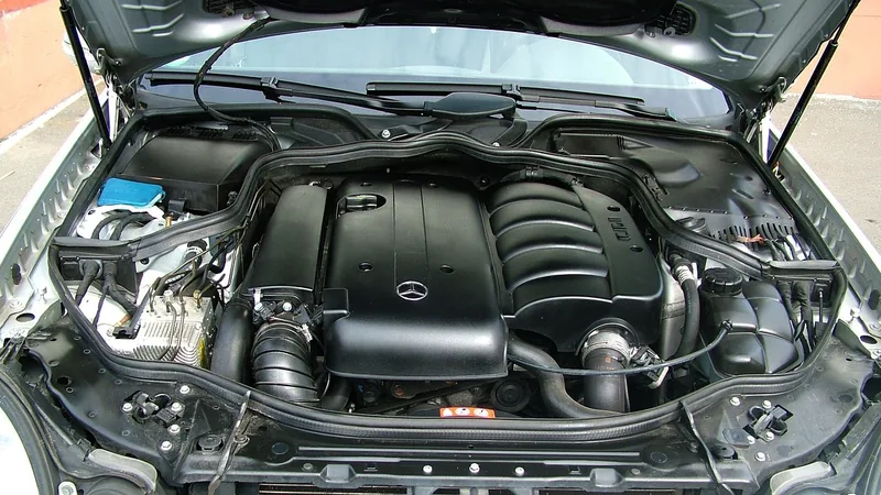 Open hood on a car showing a clean engine bay for a visual check