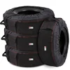 Set of four black Rosefray tire storage totes stacked around tires