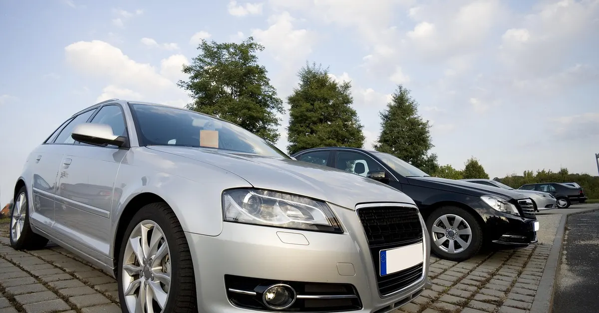 Used cars parked in a row at a car lot