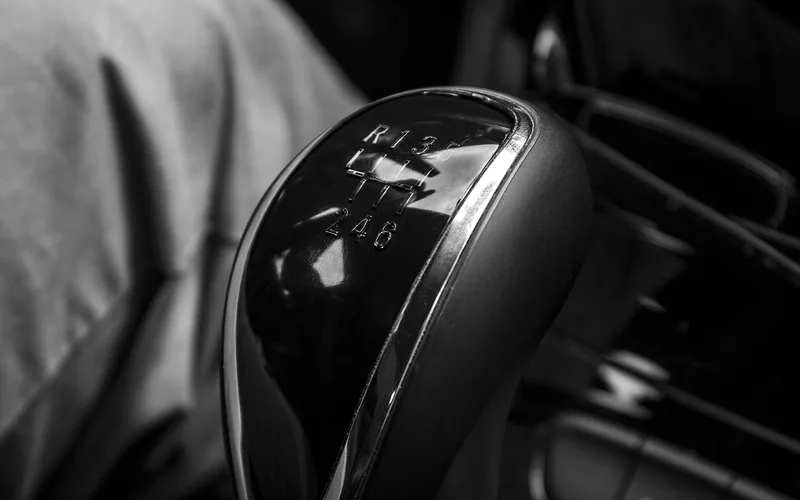 Close-up of a six-speed shift knob with the shift pattern on its top