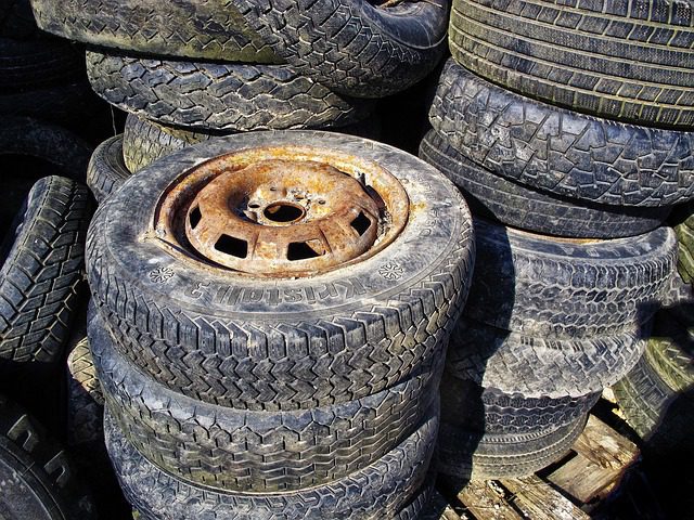 Stack of car tires in storage showing proper flat stacking method