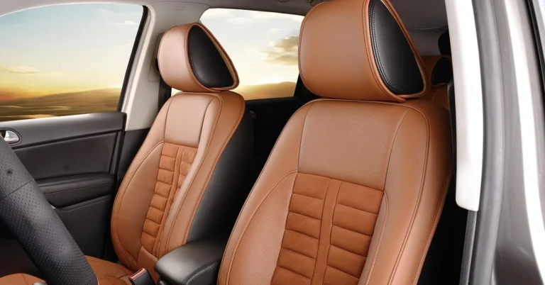 Tan leather front car seats with black headrest panels
