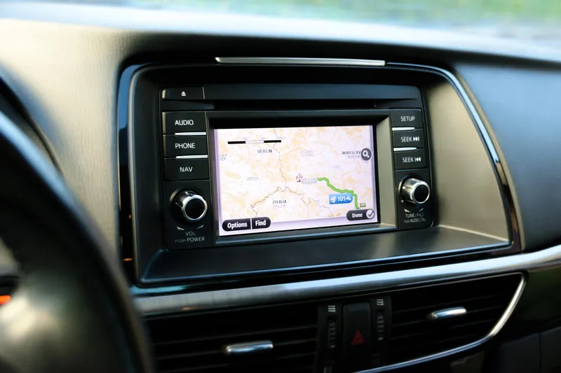 Car head unit with a map display, volume knob and Nav button