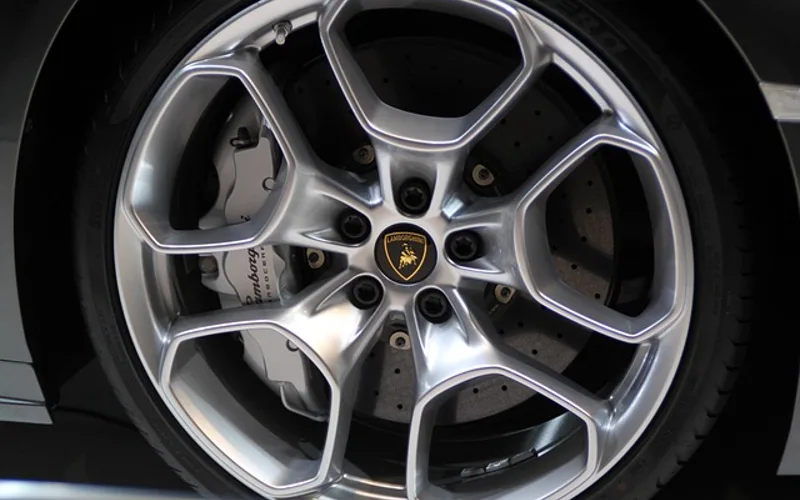 Close-up of a wheel hub assembly on a car, the part that connects the tire to the axle.