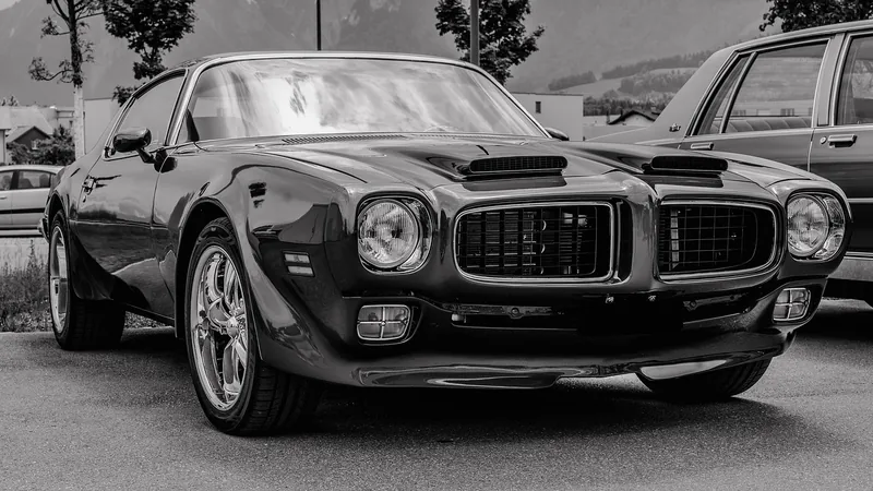 Black and white photo of a Pontiac performance coupe from the muscle car era