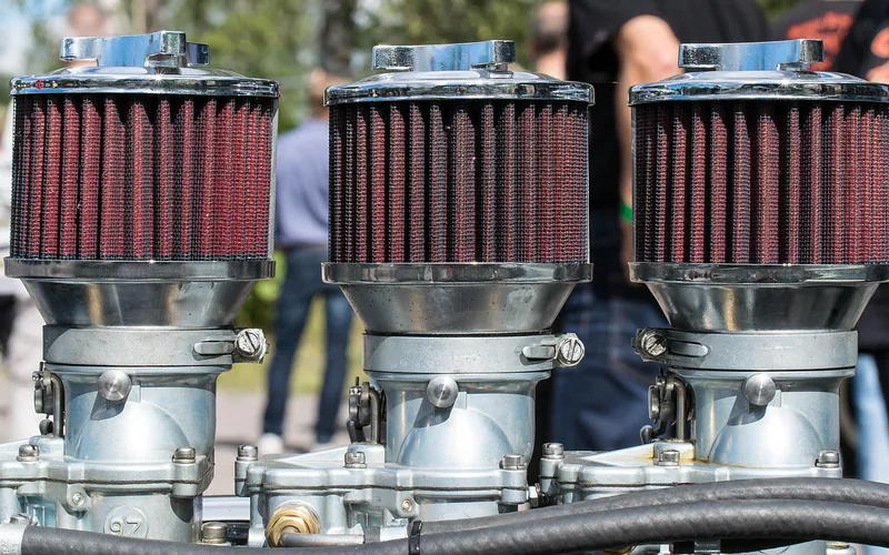 Car engine bay showing the air filter housing near the intake manifold