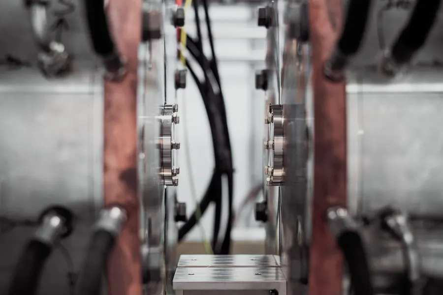 Heavy insulated cables and copper bars inside an equipment cabinet