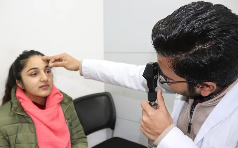 Optometrist performing a vision and refraction test with eyeglasses lenses Optometrist performing a vision and refraction test with eyeglasses lenses