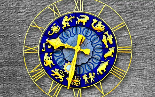 Ornate clock face with gold hands on a blue dial