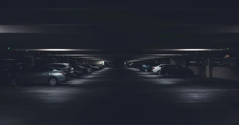 Cars parked in a dark underground garage