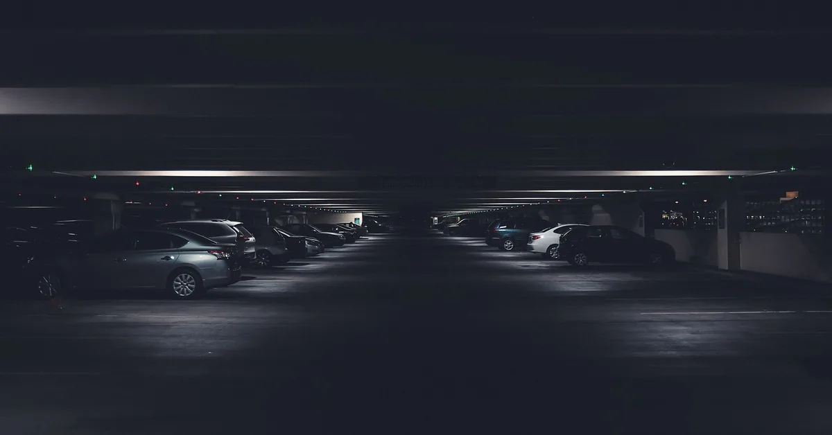 Cars parked in a dark underground garage