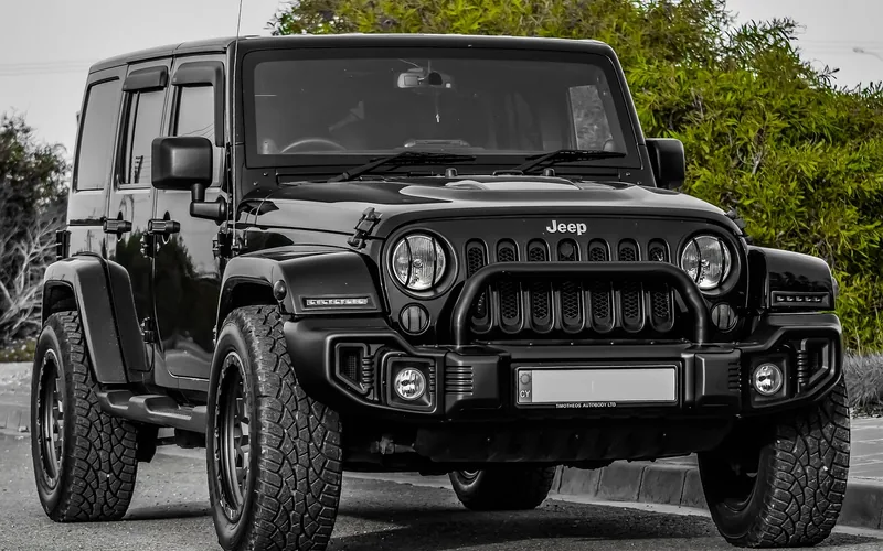Lifted SUV with tall stance and large tires showing high ground clearance Lifted SUV with tall stance and large tires showing high ground clearance